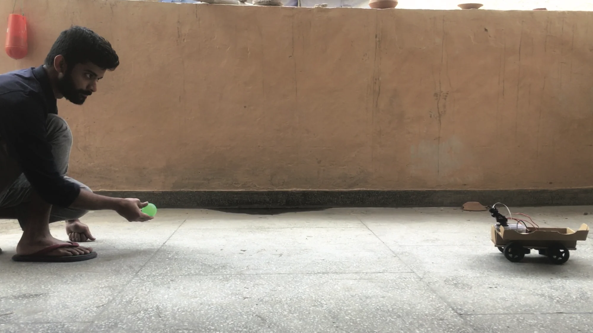 View of the bot and the target object (the green ball)
